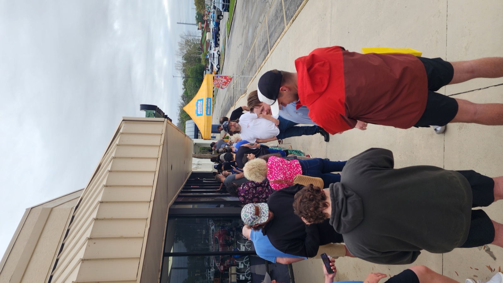 The line at the Bricks and Minifigs Leesburg grand opening wrapped through the shopping plaza