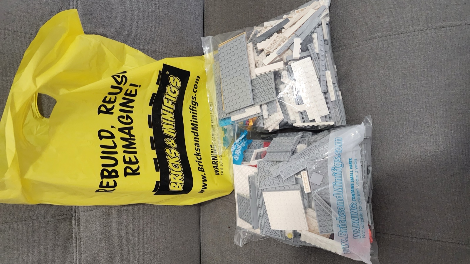 The haul spread out  -  two bags of gray and white bricks and plates for the Pagoda