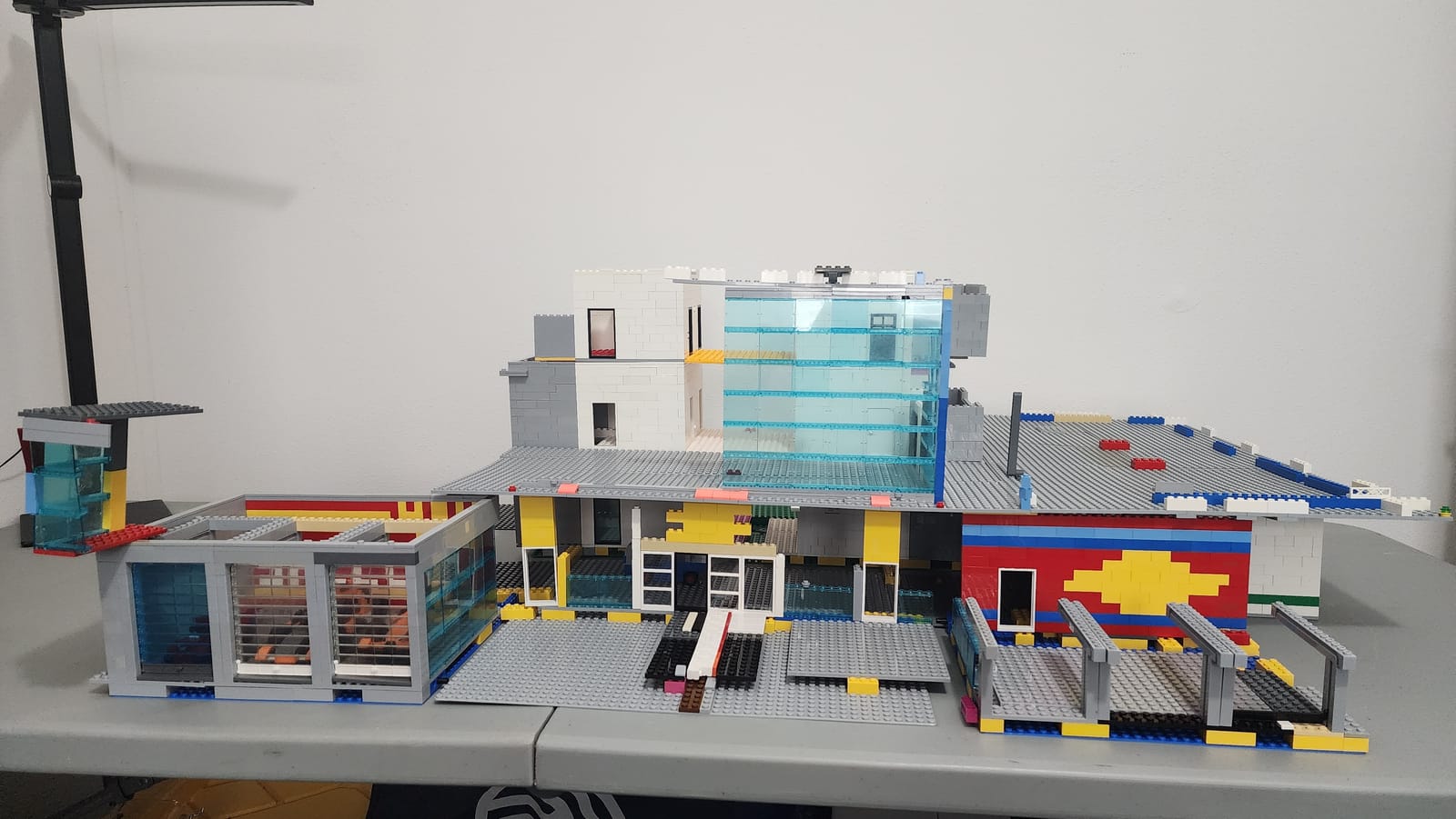Full width view of the IMS Pagoda LEGO build showing the glass wall test on the front facade, built to half width